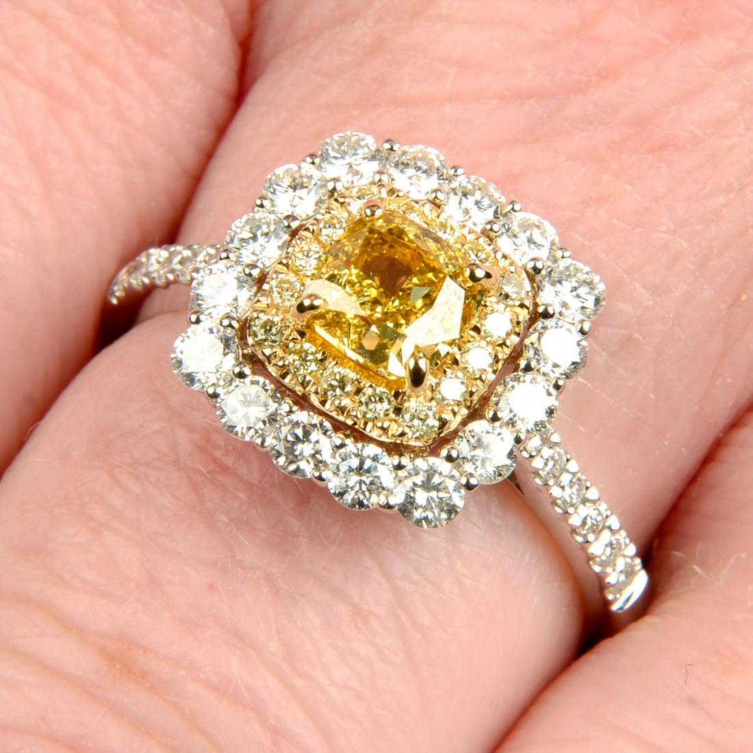 An 18ct gold Fancy Deep Yellow diamond, diamond and 'yellow' diamond dress ring.With report (1 of 5)