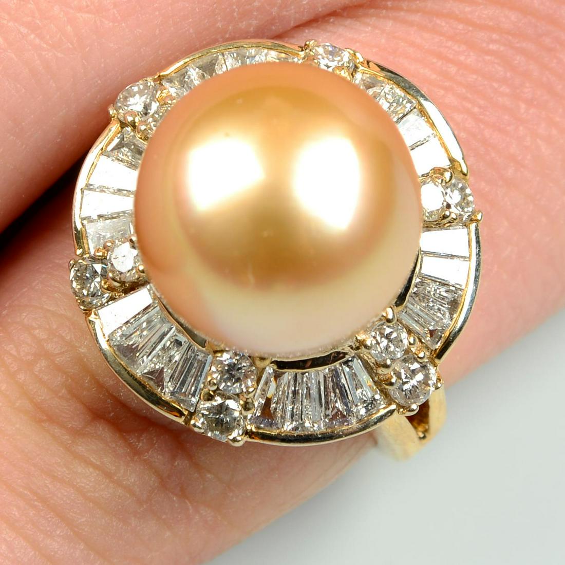 A cultured pearl dress ring, with tapered baguette and brilliant-cut diamond surround.Cultured pearl (1 of 5)