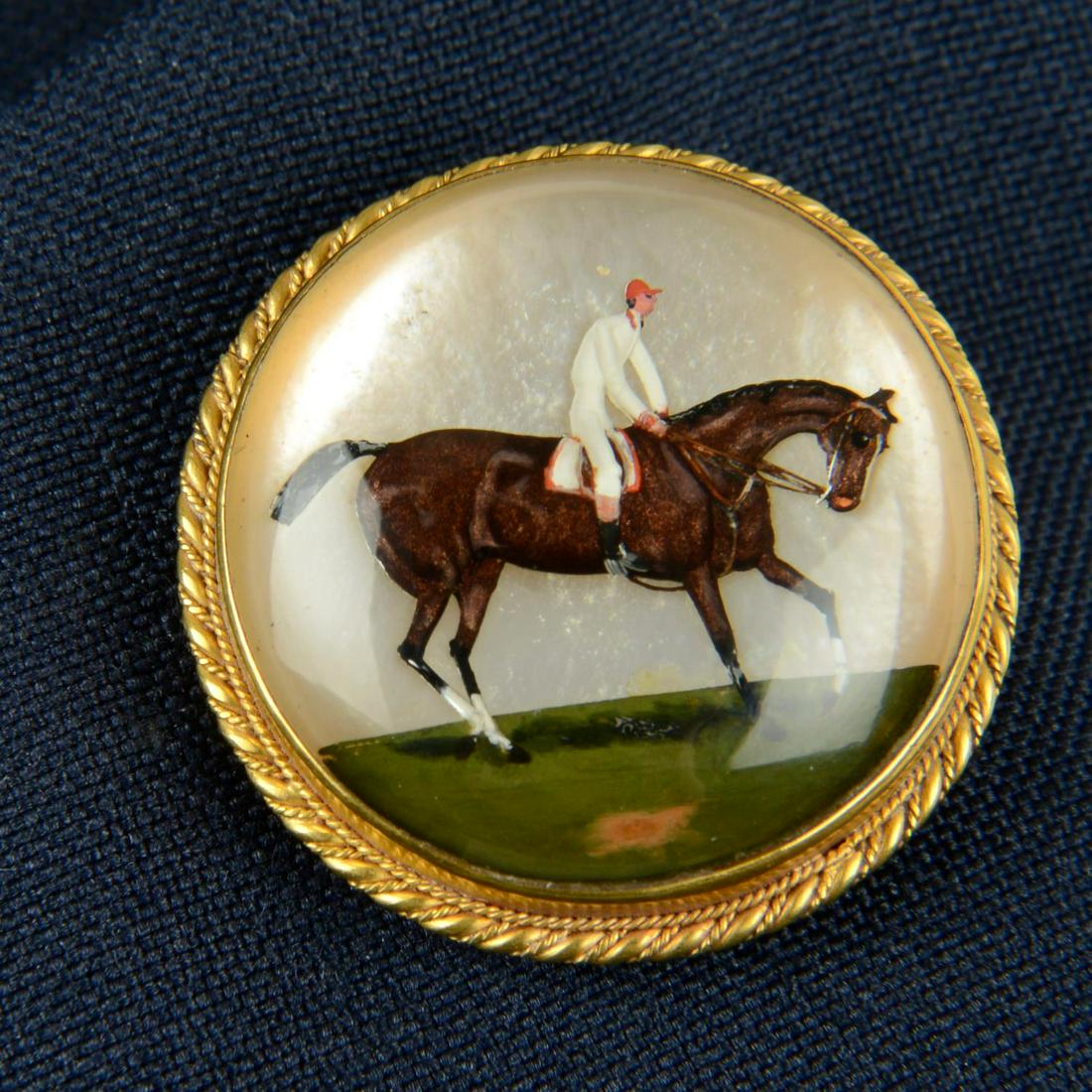 A late Victorian gold reverse carved and painted rock crystal jockey on racehorse presentation (1 of 4)