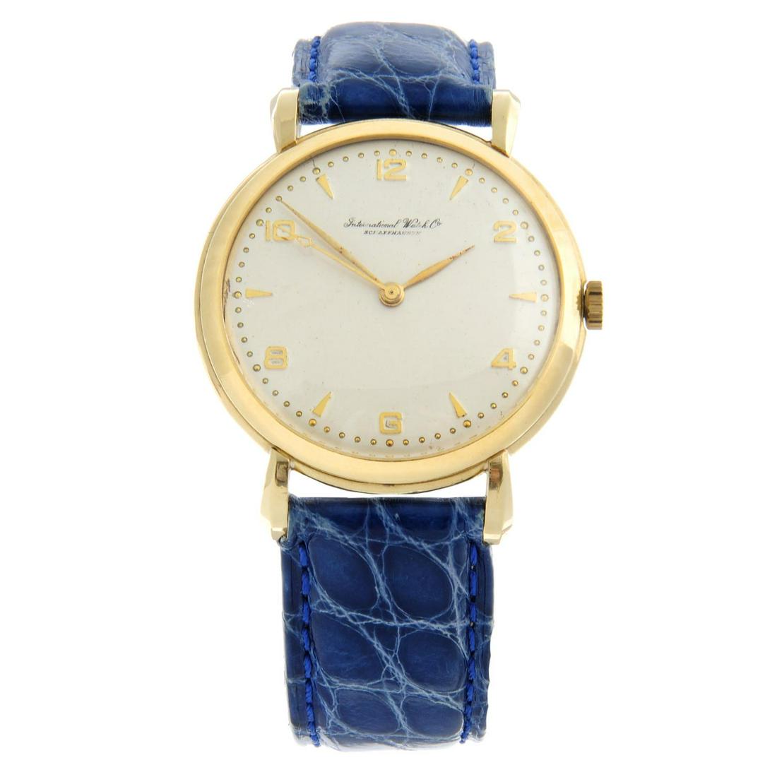 IWC - a wrist watch. Yellow metal case, stamped 18K 750. Case width 36mm. Numbered 1216560. Signed (1 of 5)