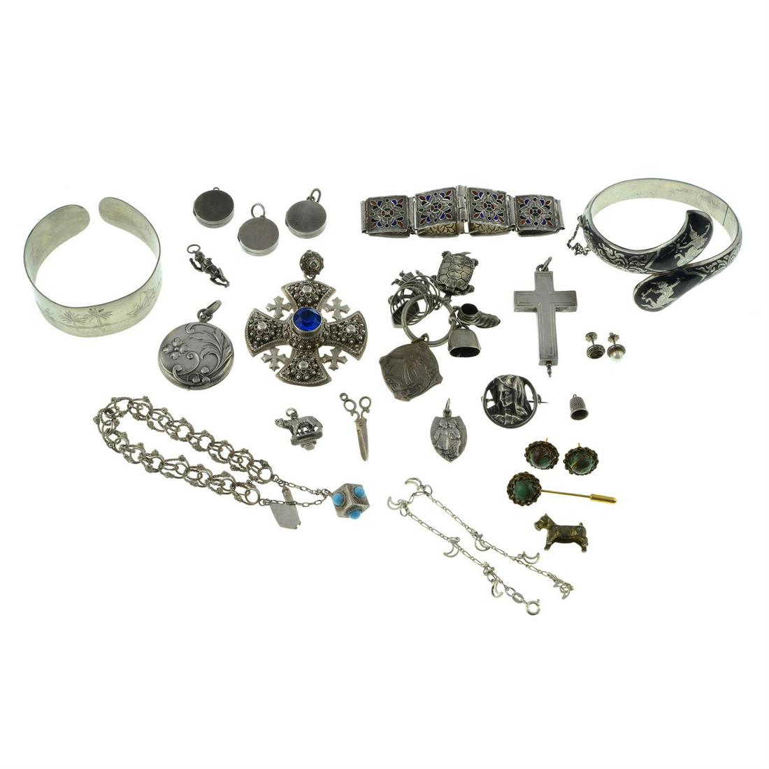 A selection of jewellery.: A selection of jewellery to include pendants, charms, bracelets and further items. 210gms. Conditi