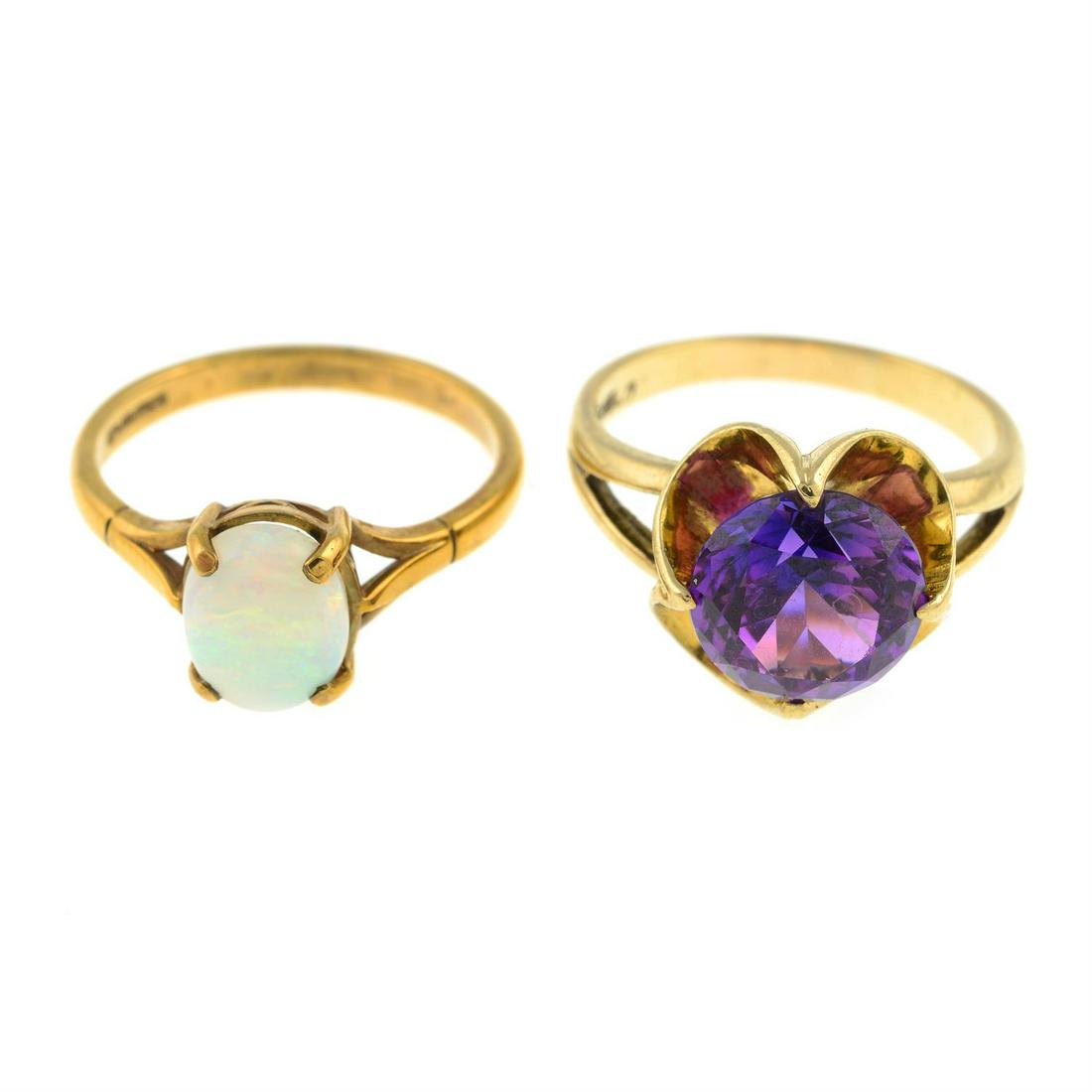 A 9ct gold opal single-stone ring and a synthetic colour-change sapphire single-stone ring.: A 9ct gold opal single-stone ring, hallmarks for Birmingham, ring size O1/2, 2.4gms. A synthetic colour-change sapphire single-stone ring, stamped 9ct, ring size P, 5.4gms. Condition Report: General s