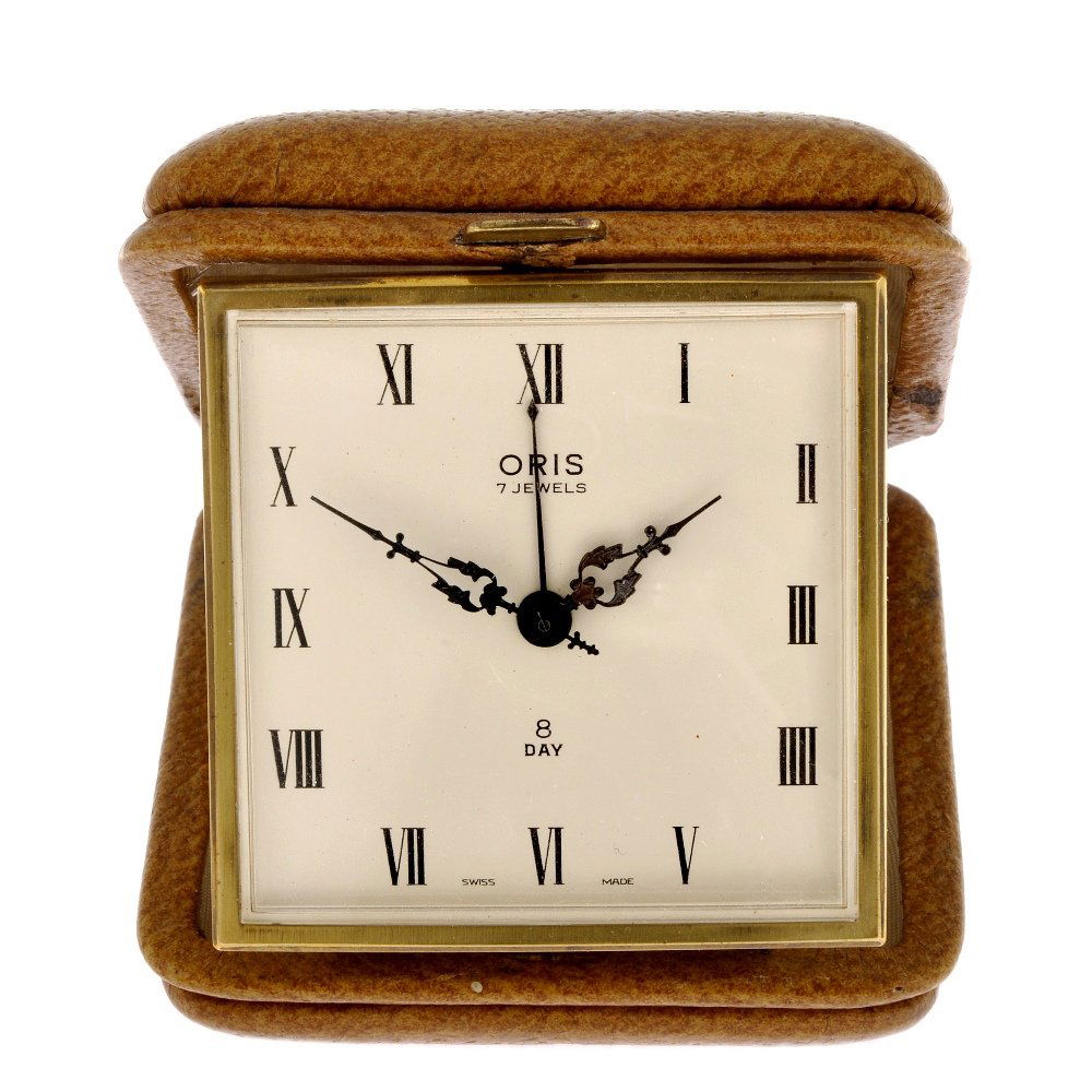 A small group of seven alarm clocks.: A small group of seven various travel clocks, to include examples by Cyma and Oris, majority offered for repairs or spare purposes only.