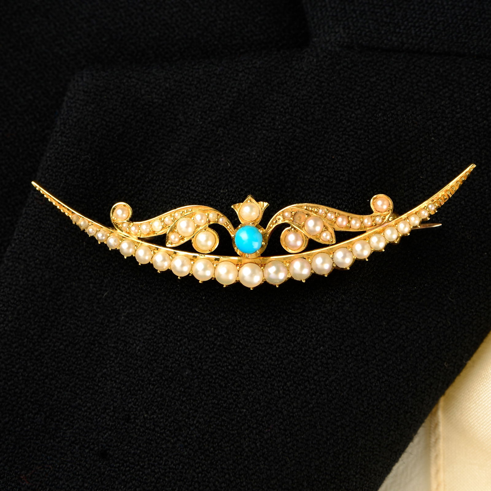 An early 20th century gold turquoise and split pearl scrolling crescent brooch.Length 6.2cms. (1 of 4)