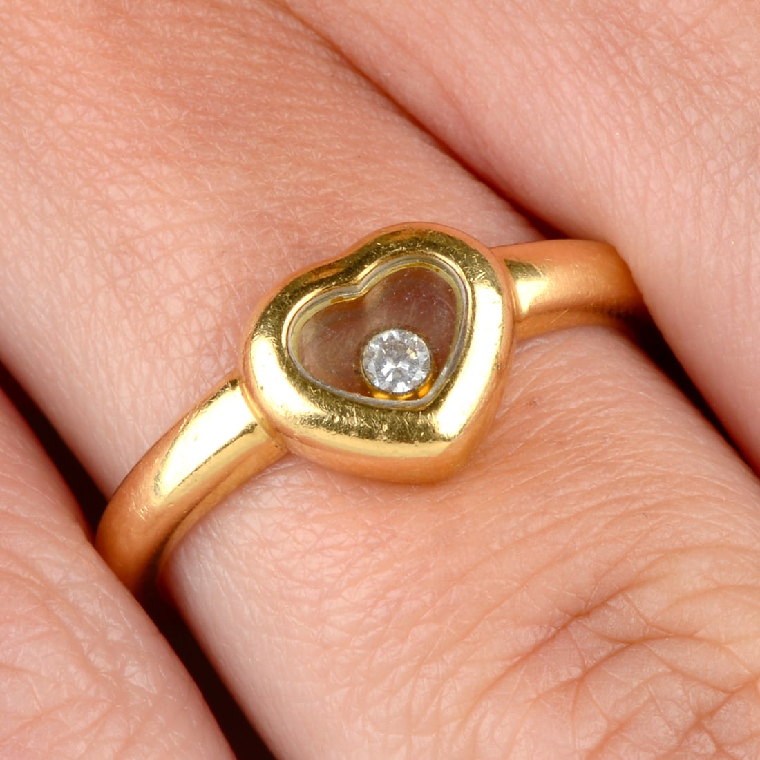 An 18ct gold 'Happy Diamonds' diamond ring, by Chopard.Stamped 750. Swiss convention marks.Ring size (1 of 5)