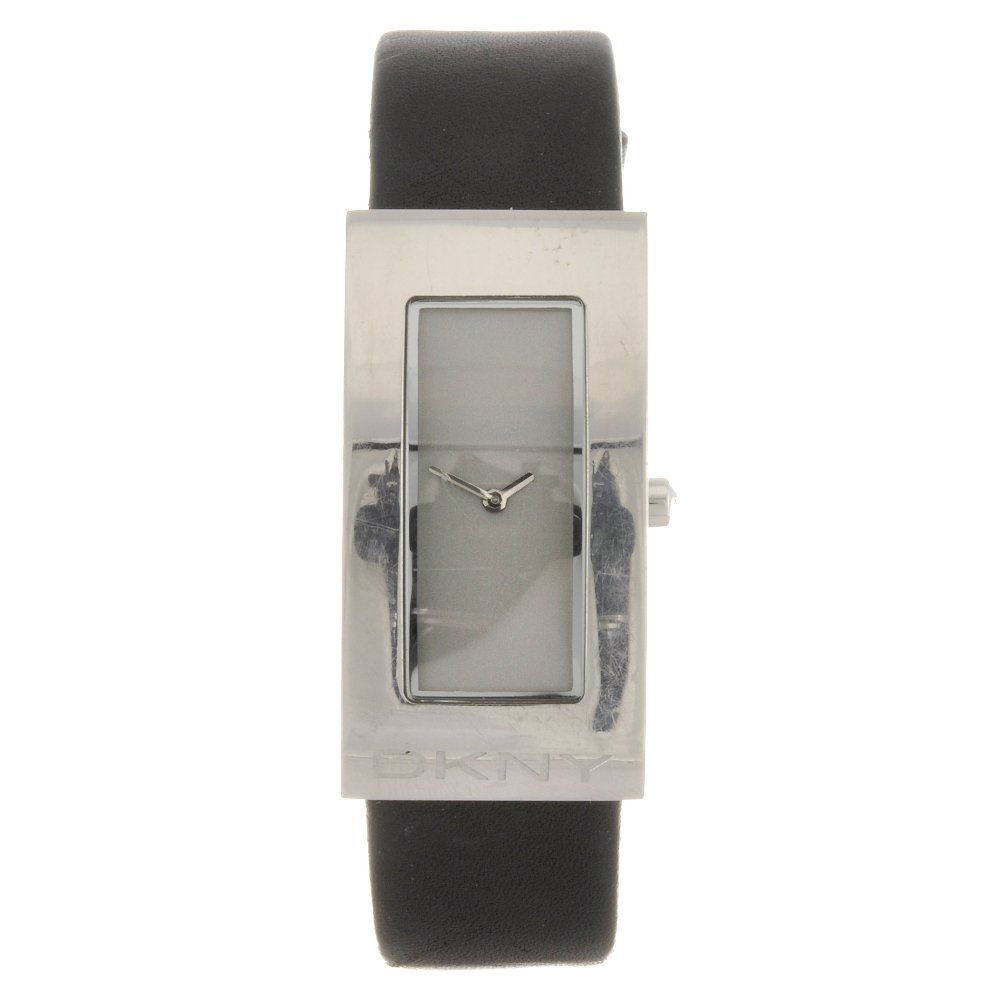 A stainless steel quartz DKNY wrist watch together: A stainless steel quartz DKNY wrist watch, the plain silvered dial, curved rectangular case, numbered NY-4011, fitted to an original black leather strap with pin buckle. Case width 23mm. Together with