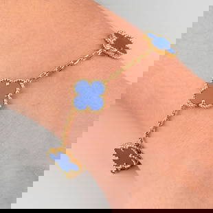 An 18ct gold agate 'Vintage Alhambra' bracelet, by Van Cleef & Arpels.French convention marks.: An 18ct gold agate 'Vintage Alhambra' bracelet, by Van Cleef & Arpels.French convention marks. Length 19.4cms. 10.8gms.With maker's case.