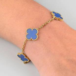 An 18ct gold agate 'Vintage Alhambra' bracelet, by Van Cleef & Arpels.French convention marks.: An 18ct gold agate 'Vintage Alhambra' bracelet, by Van Cleef & Arpels.French convention marks. Length 19.4cms. 10.8gms.With maker's case.