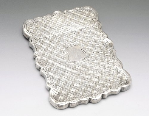 Victorian silver card case, Hilliard & Thomason Bi: Victorian silver card case of rectangular form with scroll shaped surround, diaper engraving and central vacant shield shaped cartouche. Hallmarked Hilliard & Thomason Birmingham 1858. Height measurin