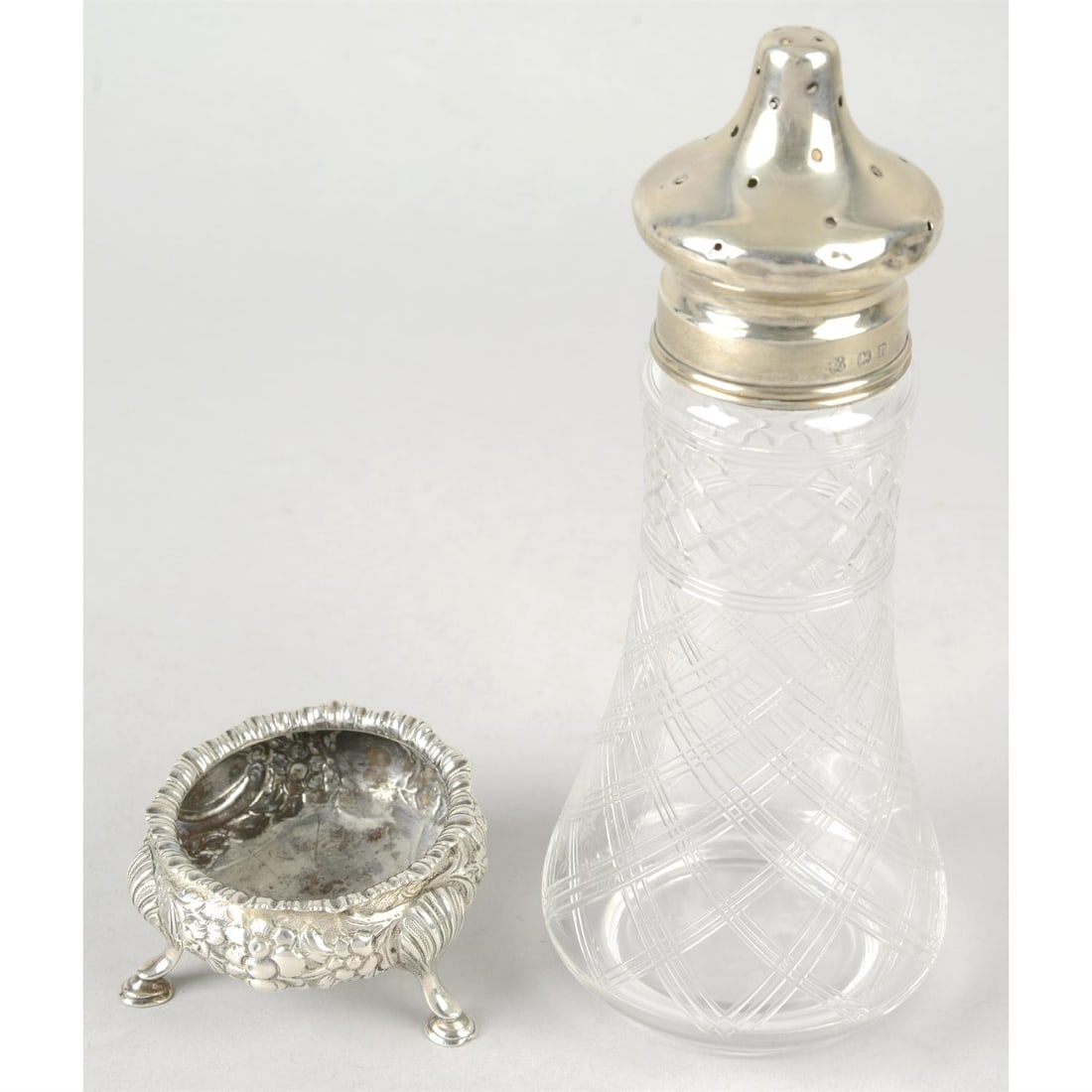 Victorian silver salt & a George V silver mounted caster; together with a quantity of silver plate.: A late Victorian silver cauldron salt, raised on hoof feet upon shell mount, hallmarked Charles Stuart Harris, London 1891, weight 2.57ozt (80g), plus a George V silver mounted glass caster, hallmarke
