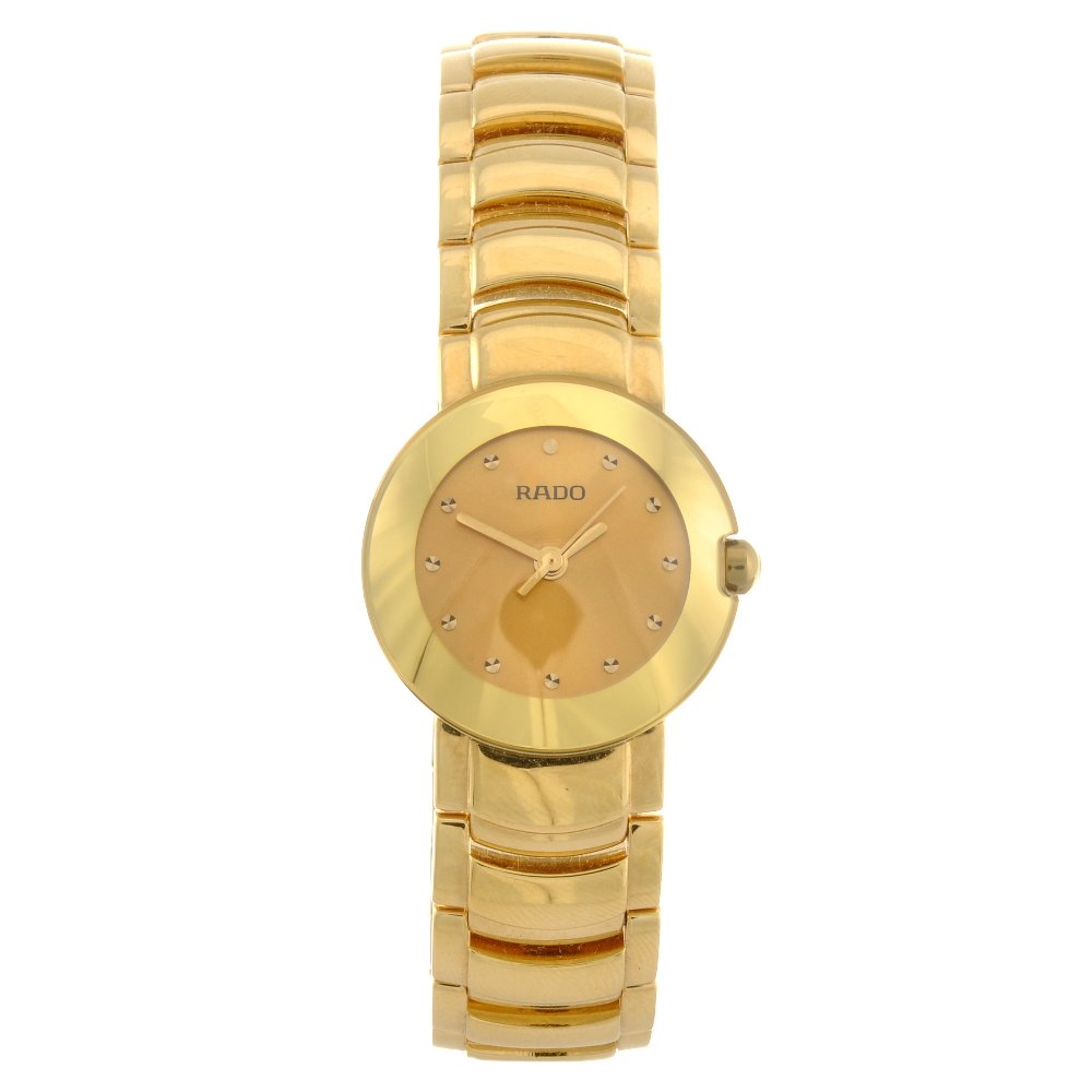 A gold plated quartz lady's Diastar bracelet watch.: RADO - a gold plated quartz lady's Diastar bracelet watch, champagne tone dial with hourly markers, round case numbered 318.0551.3, fitted to an integral gold plated link bracelet with double folding