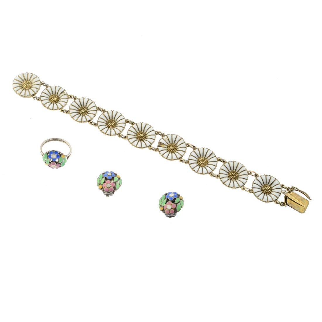 Three pieces of mid 20th century enamel jewellery by Bernard Instone & Anton Michelsen: A mid 20th century enamel jewellery set, to include a ring & pair of clip on earrings, by Bernard Instone, ring size L, Earring length 1.4cm, 8.4gm. A mid 20th century silver enamel daisy bracelet, by