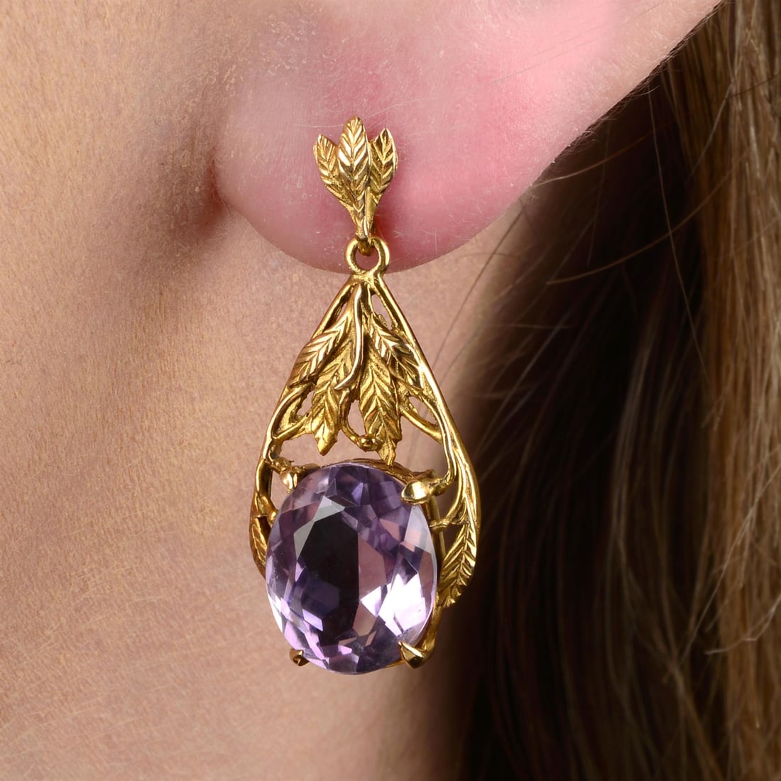 Arts & Crafts earrings, attrib. to Bernard Instone: A pair of Arts & Crafts 9ct gold amethyst earrings, attributed to Bernard Instone. Length 3.2cms. 5.9gms. Condition Report: Surface scratches and minor marks.Amethyst appear a well matched light mediu