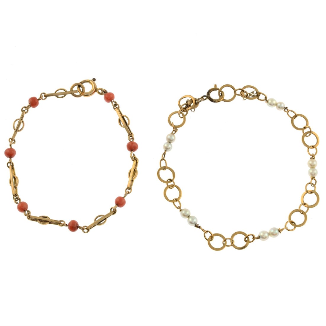 Two fancy-link bracelets: Two fancy-link chain bracelets, one with cultured pearl spacers and one with coral bead spacers. Both stamped 9CT. Lengths 14.5 and 17cms. 5.2gms. Coral untested for natural colour origin. Condition R