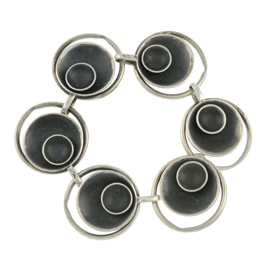 Mid 20th century bracelet, Birger Haglund: A mid 20th century Scandinavian silver circular panel bracelet, by Birger Haglund. Signed Haglund. Stamped STERLING SILVER. Length 20.5cms. 49.2gms. Condition Report: General marks, wear, discolourati