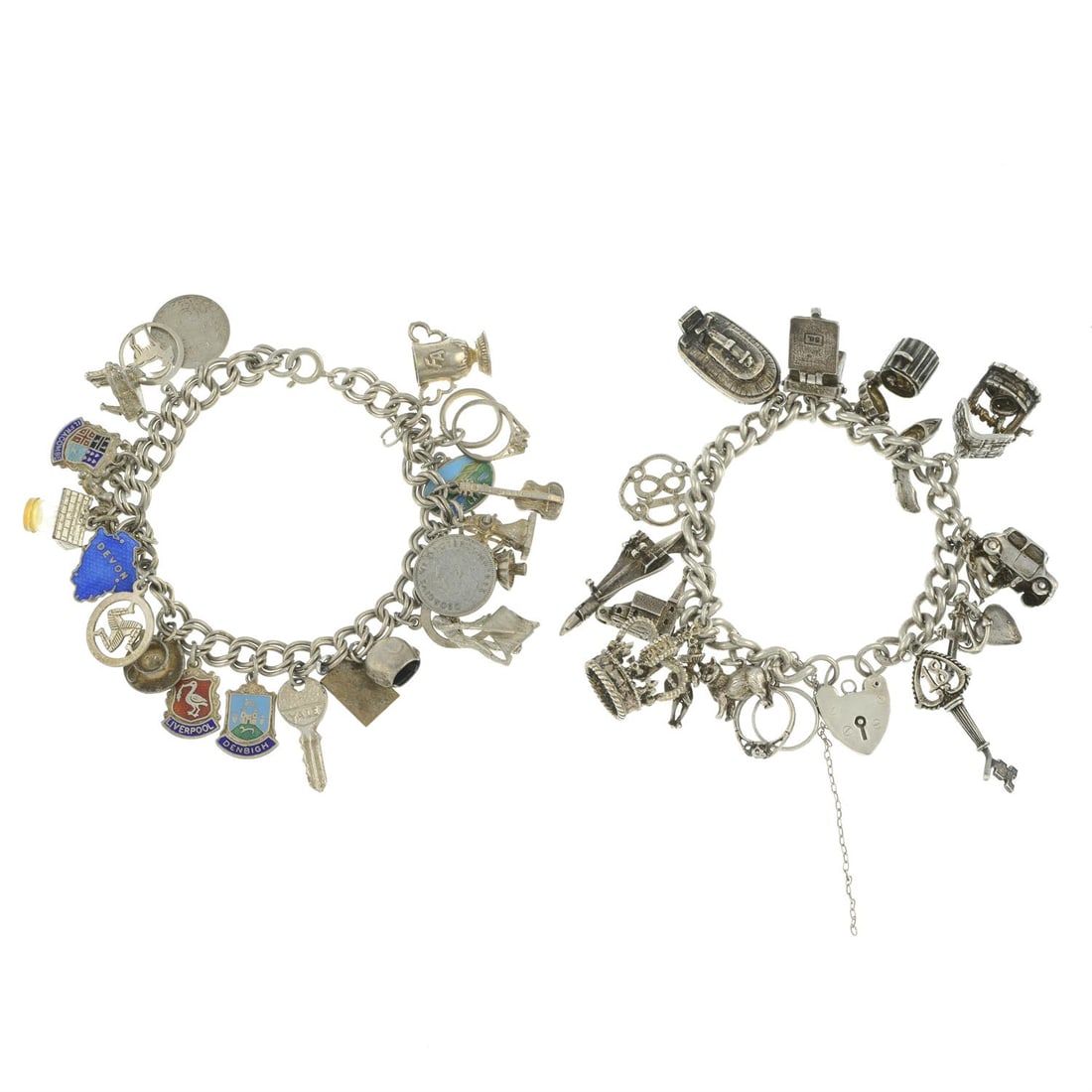 Two charm bracelets: A charm bracelet, suspending 23 charms to include a selection of enamel souvenir travel shields, some with marks to indicate silver, length 20cms, 49.9gms. A charm bracelet, suspending 15 charms to in