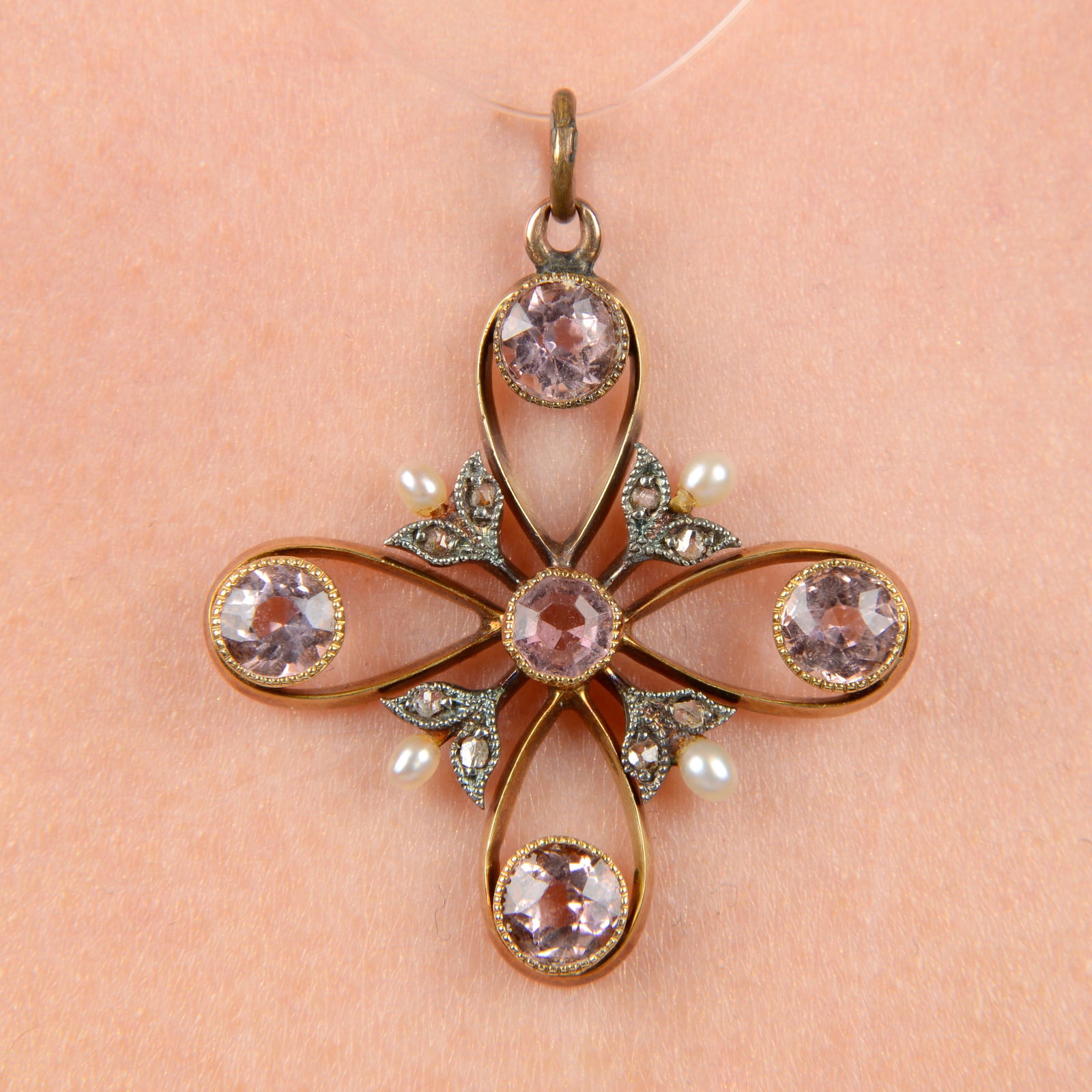 An Edwardian gold pink tourmaline, seed pearl and diamond point pendant. Length 3.7cms. 4.4gms. (1 of 3)