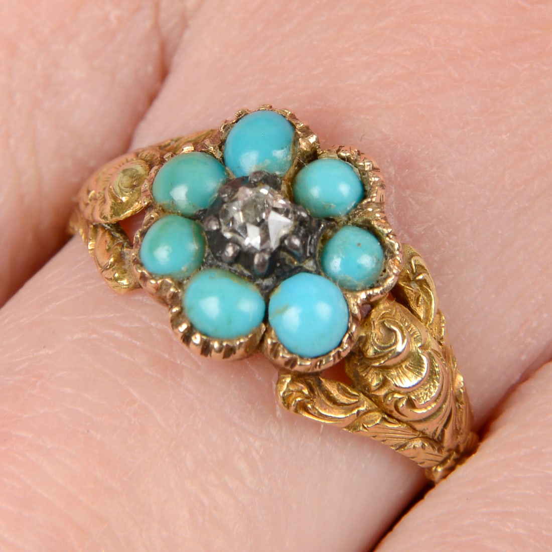 An early to mid 19th century gold diamond and turquoise floral cluster ring. Ring size P1/2. 2.4gms. (1 of 4)