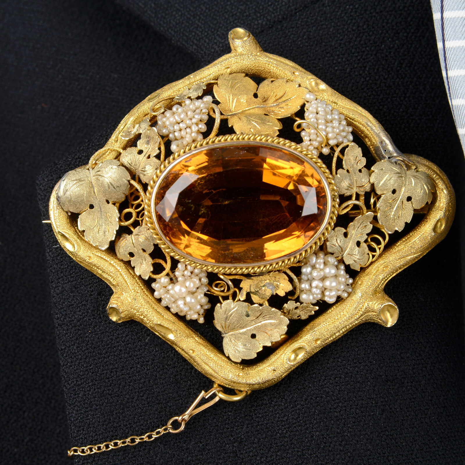 A mid 19th century gold citrine brooch, with textured bicolour gold and seed pearl grape vine (1 of 4)