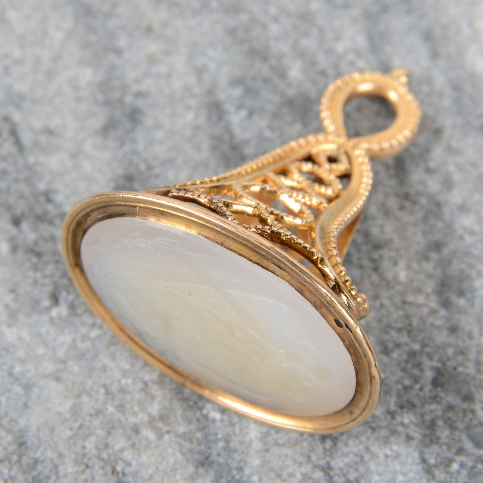 An early to mid 19th century 15ct gold chalcedony fob seal, carved for a Lady married into the Law: An early to mid 19th century 15ct gold chalcedony fob seal, carved for a Lady married into the Law family. Length 3.3cms. 8.8gms. The LAW family whose main family line includes the Baron and later Ear