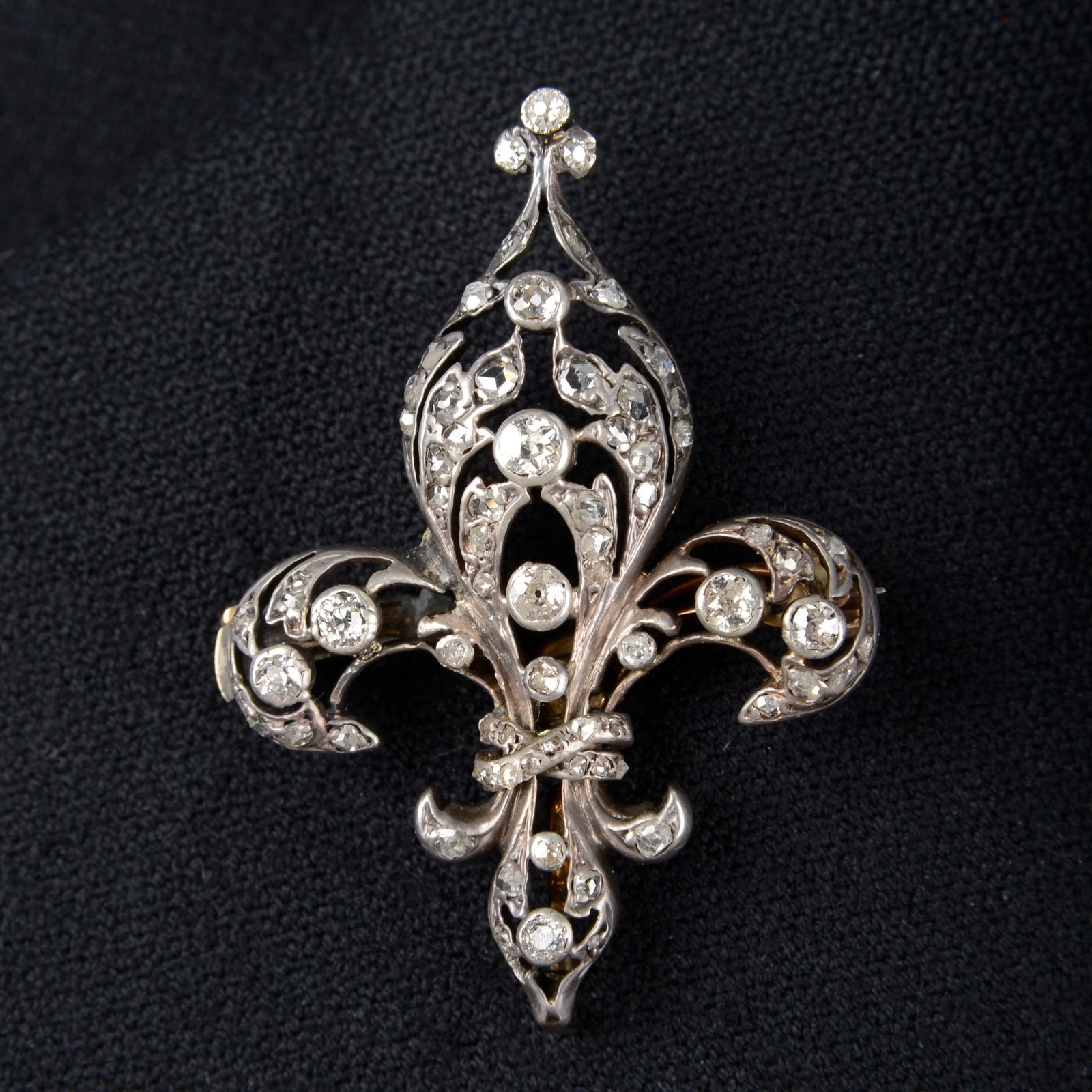 A late Victorian silver and gold old and rose-cut diamond fleur-de-lis brooch.Estimated total (1 of 3)