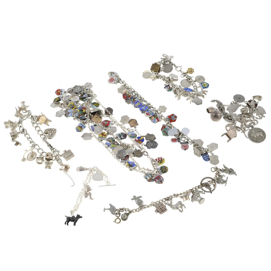 Six bracelets & necklace: A selection of six silver charm bracelets, one silver charm necklace and jump rings. Total number of charms are 151. Seventy charms approximately stamped 800, eight charms and a bracelet approximately