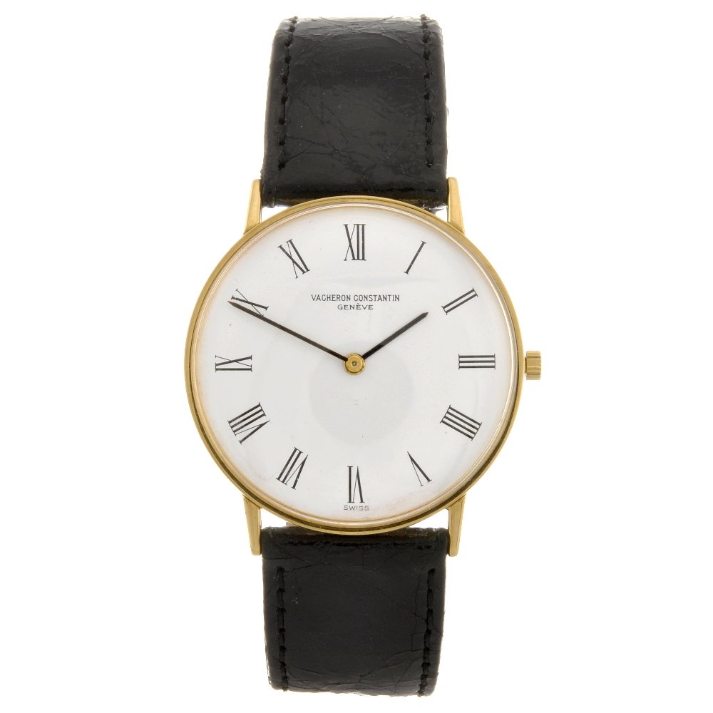 An 18ct gold manual wind gentleman's Vacheron Cons: VACHERON CONSTANTIN - an 18ct gold manual wind gentleman's wrist watch, the white dial with black Roman numeral hour markers, circular shaped case, stamped with import hallmarks for London 1964, fitte