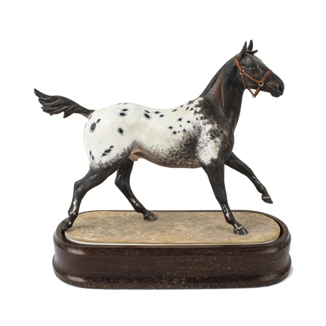 Royal Worcester Appaloosa Stallion: A Royal Worcester model of Appaloosa Stallion modelled by Doris Lindner, retains original plinth Condition Report: No certificate Very dirty / grubby The foam inner in the plinth has perished