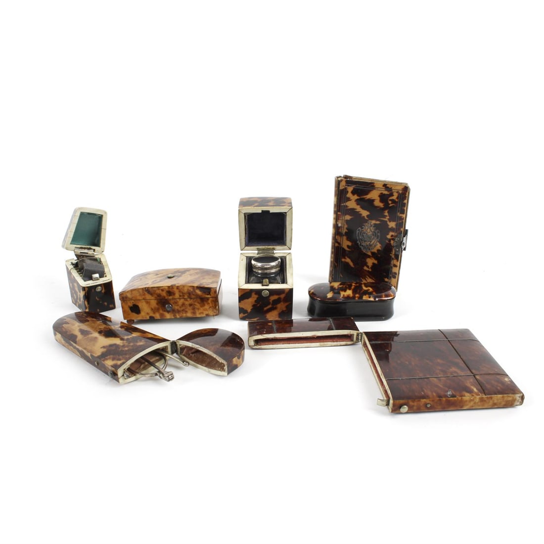 Assorted 19th century tortoiseshell items: A collection of assorted 19th century tortoiseshell items comprising a glasses case, card case, book of common prayer, snuff box, stamp box, travelling inkwell and a needle case stamped Lund Cornhill,