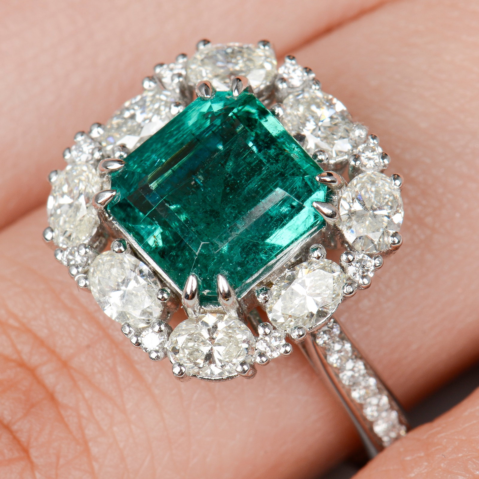 An 18ct gold Zambian emerald and vari-shape cluster ring.With report 22282, dated 21st October 2022, (1 of 5)