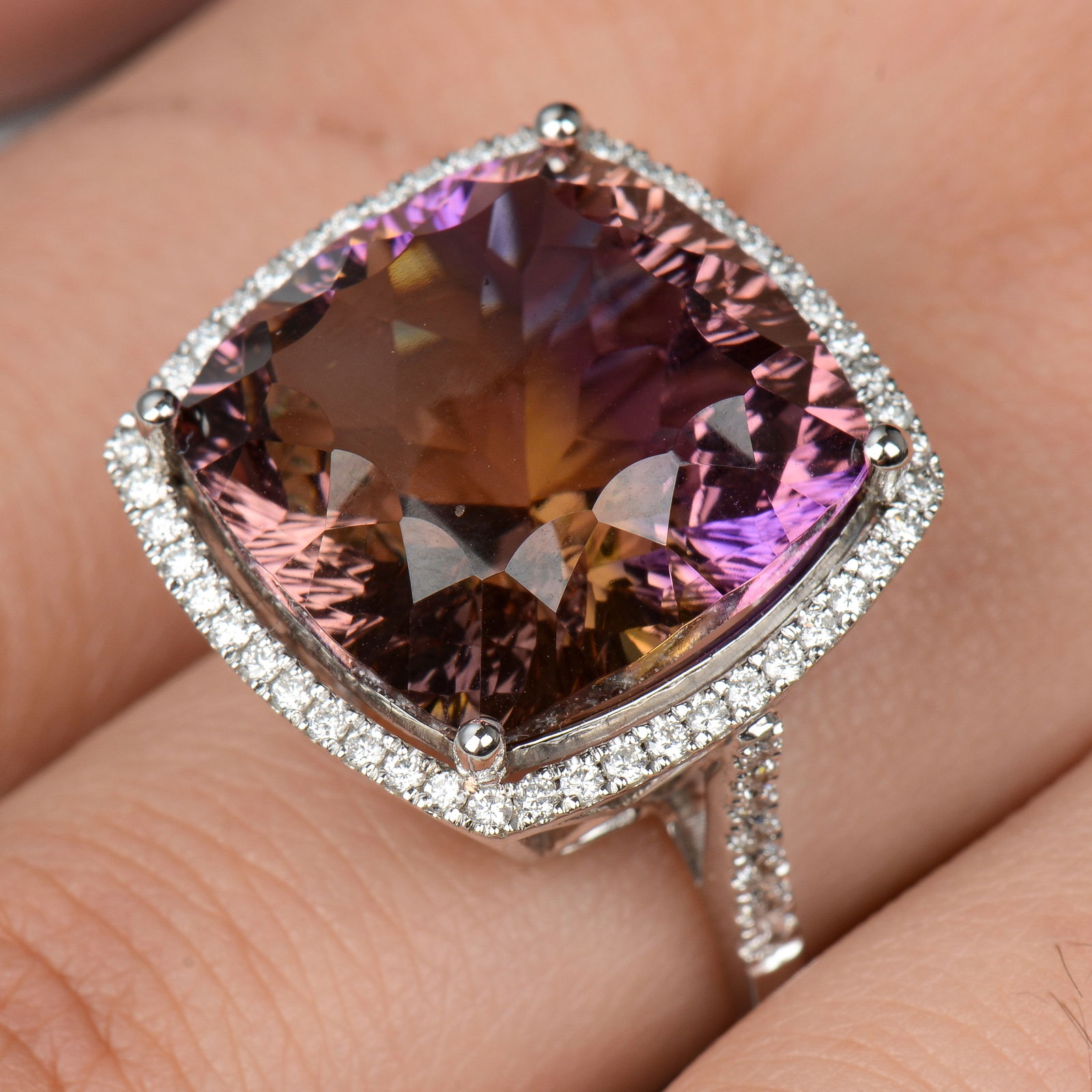 An 18ct gold ametrine and brilliant-cut diamond cluster ring. Ametrine weight 20.49cts. Total (1 of 5)