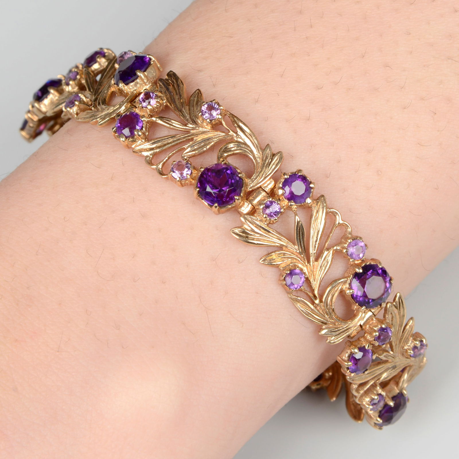 A 9ct gold amethyst foliate bracelet, by Bernard Instone. Hallmarks for Birmingham, 1970. Length: A 9ct gold amethyst foliate bracelet, by Bernard Instone. Hallmarks for Birmingham, 1970. Length 18cms. 21.9gms.