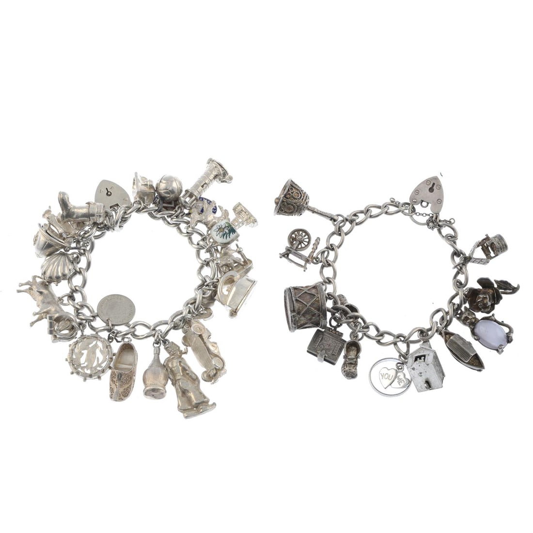 Two charm bracelets: Two charm bracelets, each suspending a selection of charms. Some with marks for silver. Total weight 158gms. Condition Report: Due to the amount of items in this lot we are unable to give a detailed c