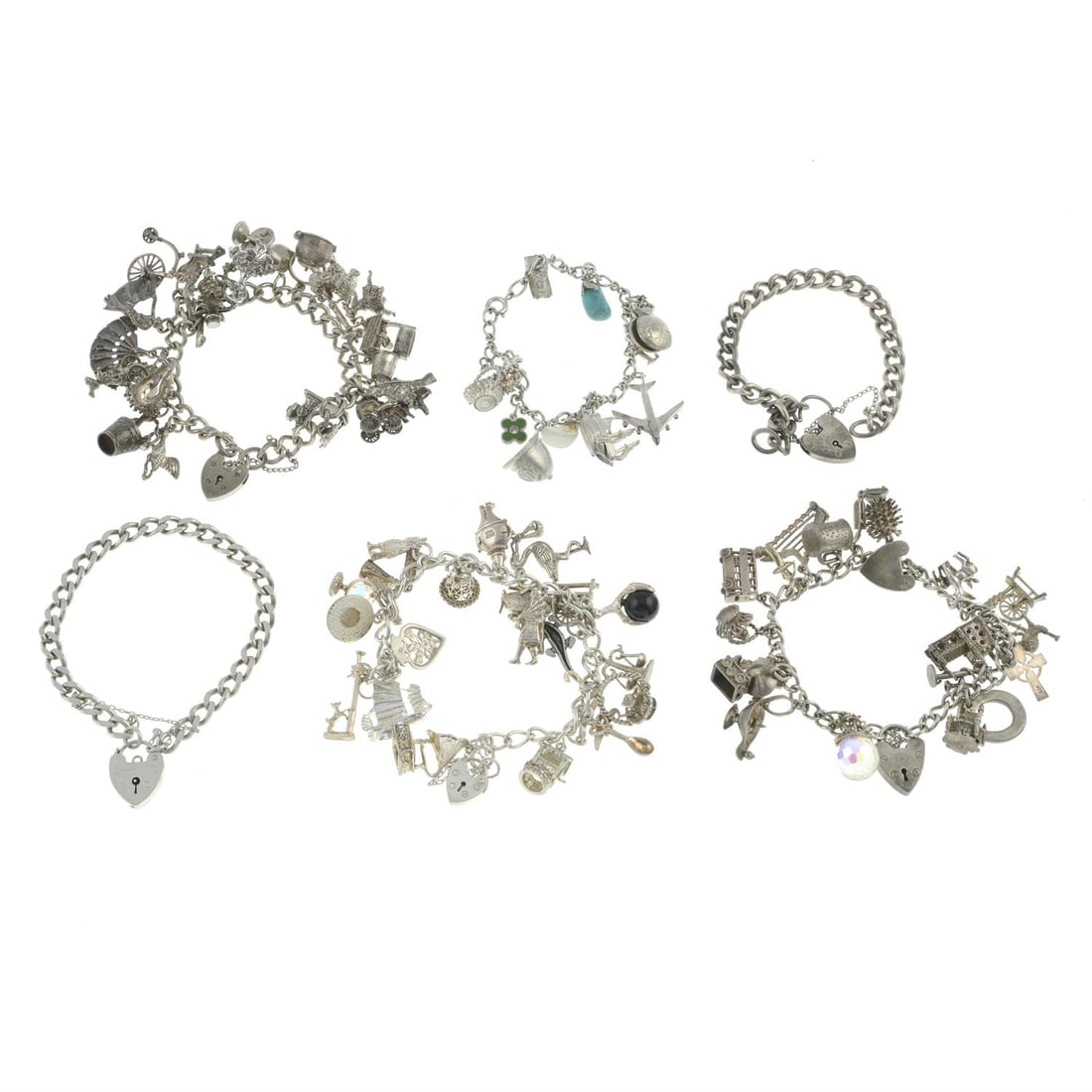 Six charm bracelets: Six charm bracelets. Each suspending a selection of charms. Some with marks and hallmarks for silver. Total weight 243gms. Condition Report: Due to the amount of items in this lot we are unable to giv