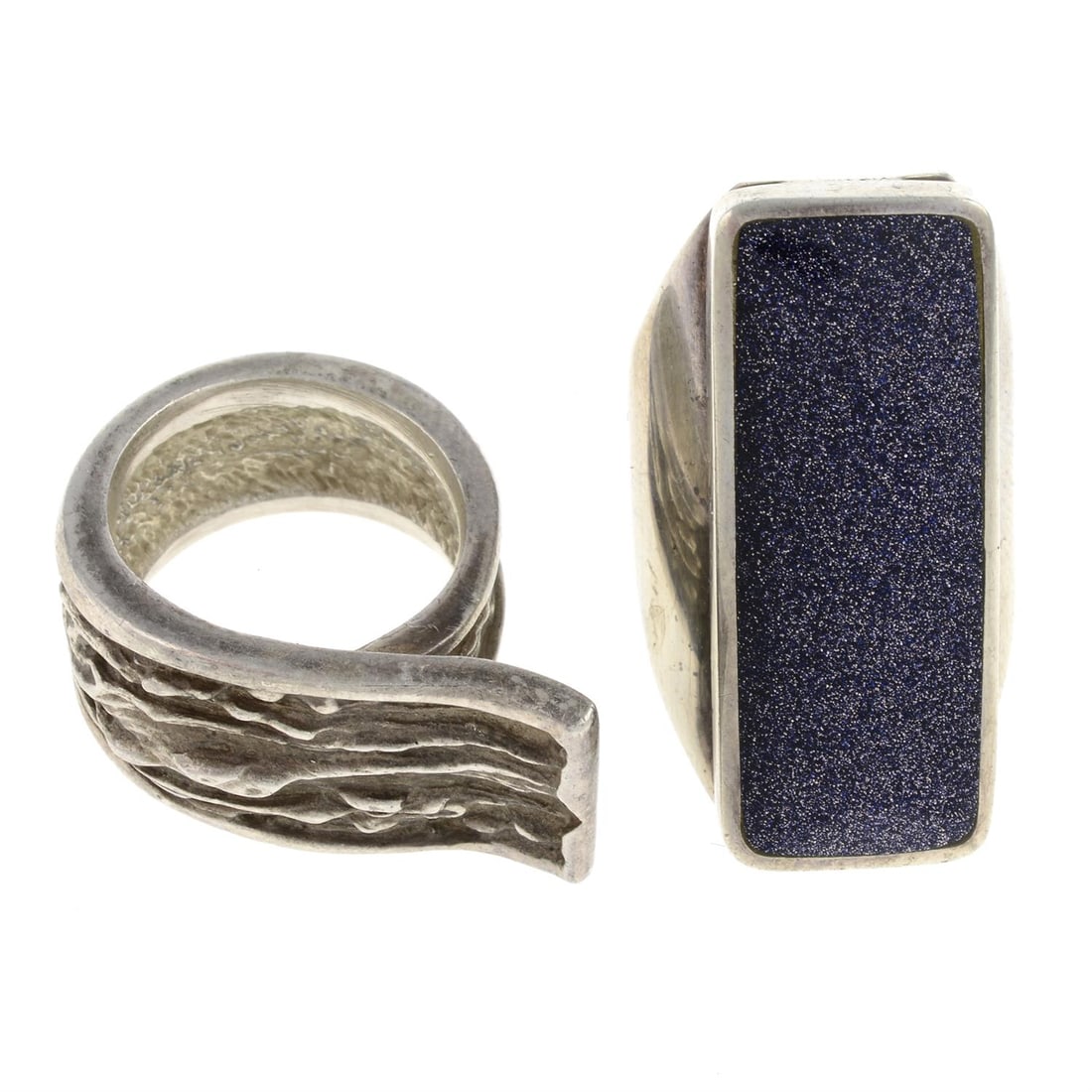 Two rings, one by David Scott Walker: A silver blue goldstone dress ring, by David Scott Walker, hallmarks for Sheffield, 2001, ring size L1/2, 11gms. A stylised bark dress ring, stamped 925S and DENMARK, approximate ring size K, 15gms. C