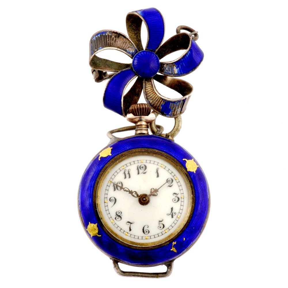 An enamelled decorated continental white metal key: A gold plated silver keyless wind open face fob watch, the white dial with hourly applied black Arabic numerals, outer minute track with gilt markers at five minute intervals, circular shaped blue ena