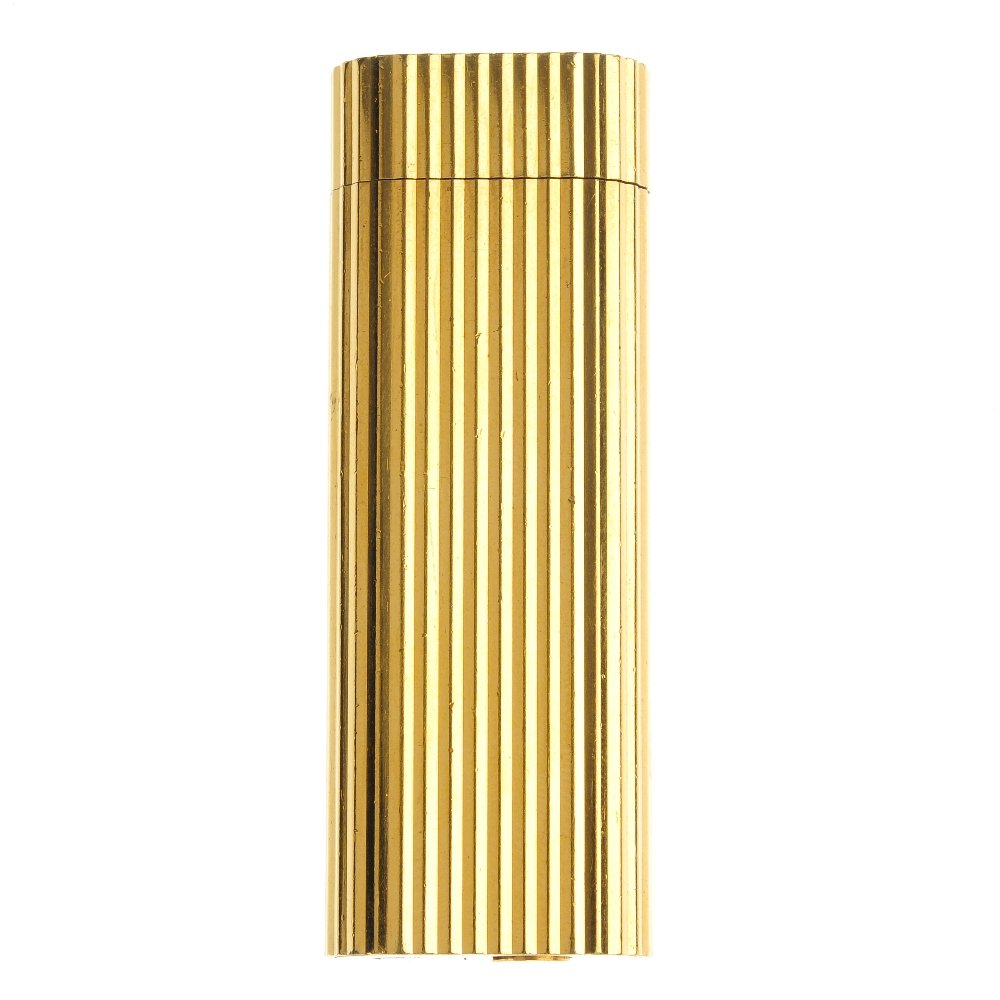 MUST DE CARTIER - a gold plated gas lighter and th: MUST DE CARTIER - a gold plated gas lighter, with ridged case, together with a gold plated Dunhill lighter, a Wedgwood Ronson lighter and a further Ronson lighter. (4) Cartier lighter with papers. Wed