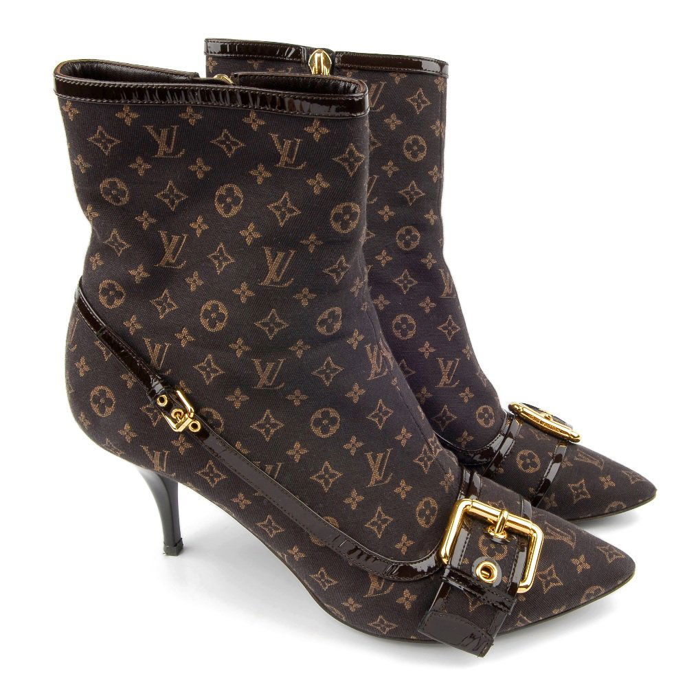 LOUIS VUITTON - a pair of Mimosa Monogram Mini An: LOUIS VUITTON - a pair of Mimosa Monogram Min Lin ankle boots, the Louis Vuitton monogram fabric trimmed with patent leather and buckle detail with mid-height stiletto heel and inner zip. Shoe size 39
