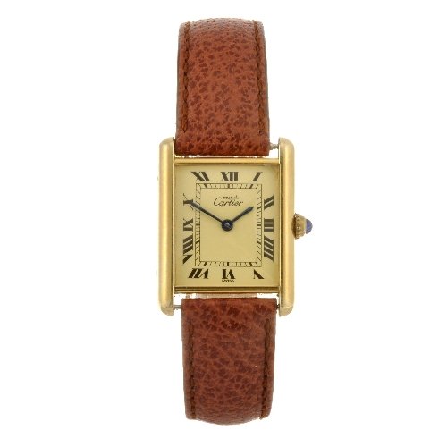 A gold plated silver quartz Cartier Must de Cartier: CARTIER - a gold plated silver Must De Cartier Tank wrist watch, the cream tone dial with hourly applied black Roman numerals, inner minute track, H shaped case, numbered 1615 257427CD, fitted to a no