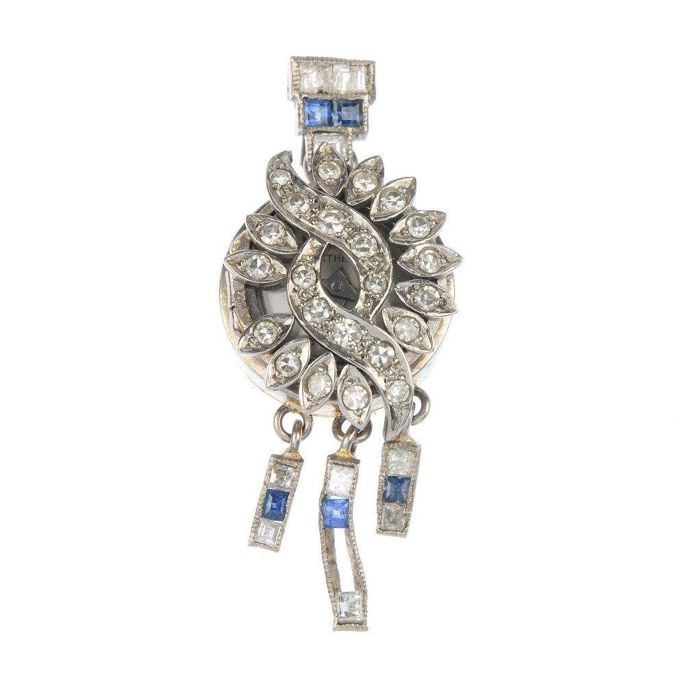 A lady's mid 20th century diamond and sapphire pen: A lady's mid 20th century diamond and sapphire pendant watch. The front designed as a single-cut diamond entwined panel, opening to reveal a circular-shape cream dial with baton markers, suspending th