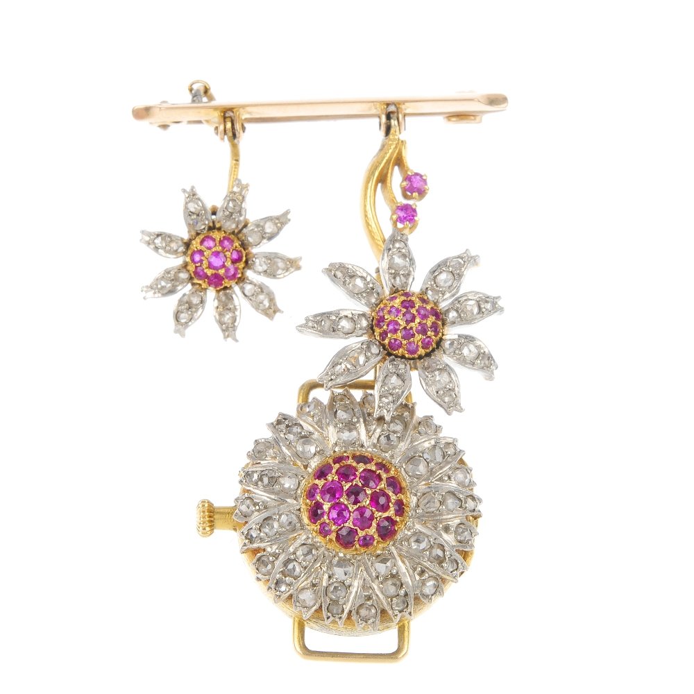 A lady's mid 20th century gold ruby and diamond fl: A lady's mid 20th century gold ruby and diamond floral fob watch. The white enamel dial with Arabic numerals, to the circular-shape ruby flower with rose-cut diamond petal reverse, suspended from a si