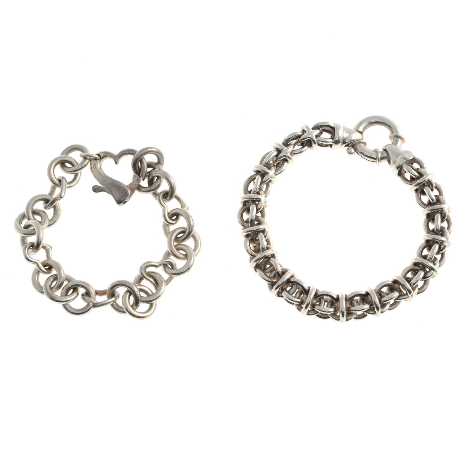 Two fancy-link bracelets.One with hallmarks for silver,: Two fancy-link bracelets.One with hallmarks for silver, Sheffield, partially indistinct, one bracelet stamped 925. Lengths 18.5 to 21.5cms. 71.8gms. Surface scratches/ wear, some varied discolouration