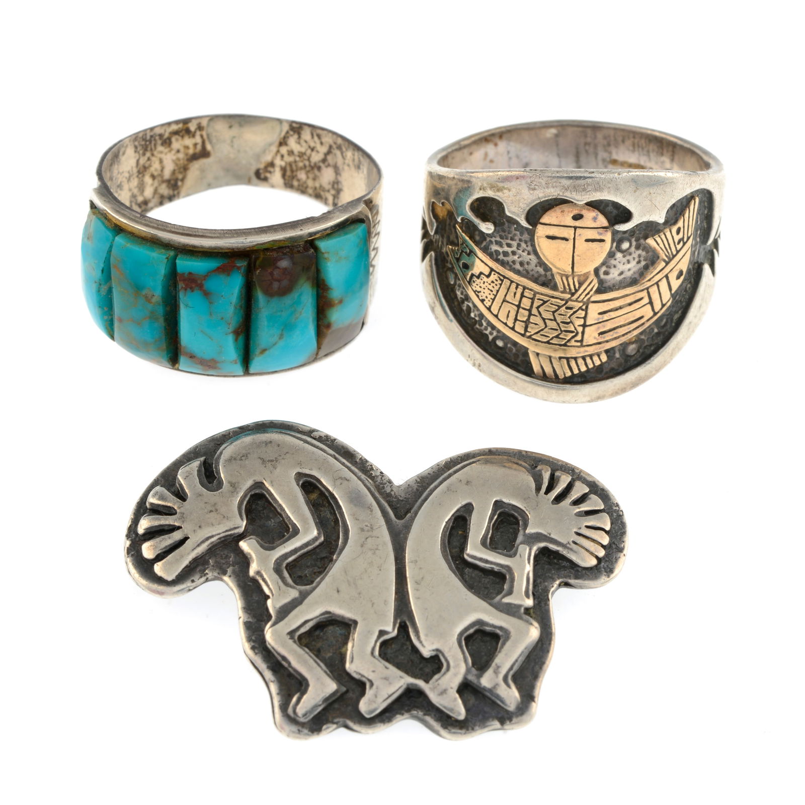 A selection of jewellery.: A selection of jewellery. To include a brooch, by John Hartman, a reconstituted turquoise ring, and a further ring. Brooch stamped STERLING, one ring with hallmarks for Birmingham, 2004, additionally