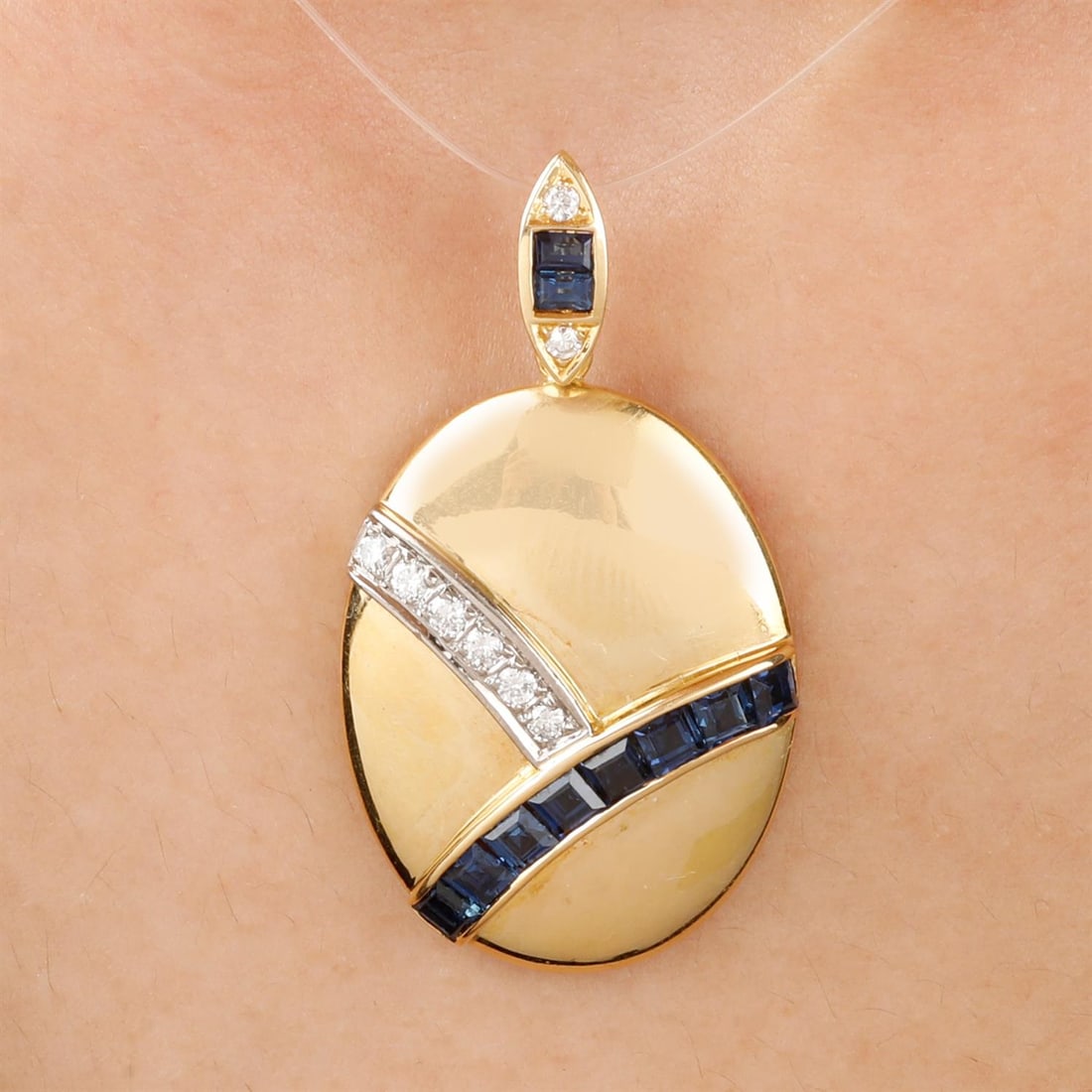 Sapphire and diamond pendant, by Carl Bucherer: An 18ct gold sapphire and diamond pendant, by Carl Bucherer. Sapphire total weight 1.31cts.Total diamond weight 0.16ct. Hallmarks for London, 2011. Length 3.7cms. 9.3gms. Condition Report: Surfa