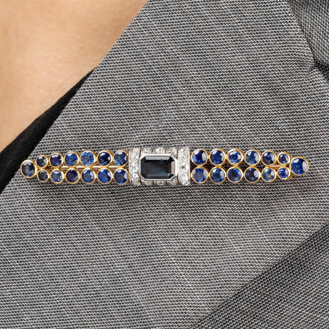 'Barrette' brooch, by Suzanne Belperron: A mid 20th century platinum and gold sapphire and old-cut diamond 'Barrette' brooch, by Suzanne Belperron. With Certificate of Origin from Olivier Baroin stating that the brooch was manufactured by Gr