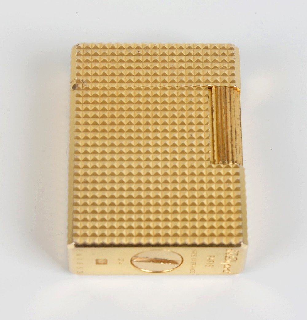An S. T. Dupont goldplated lighter