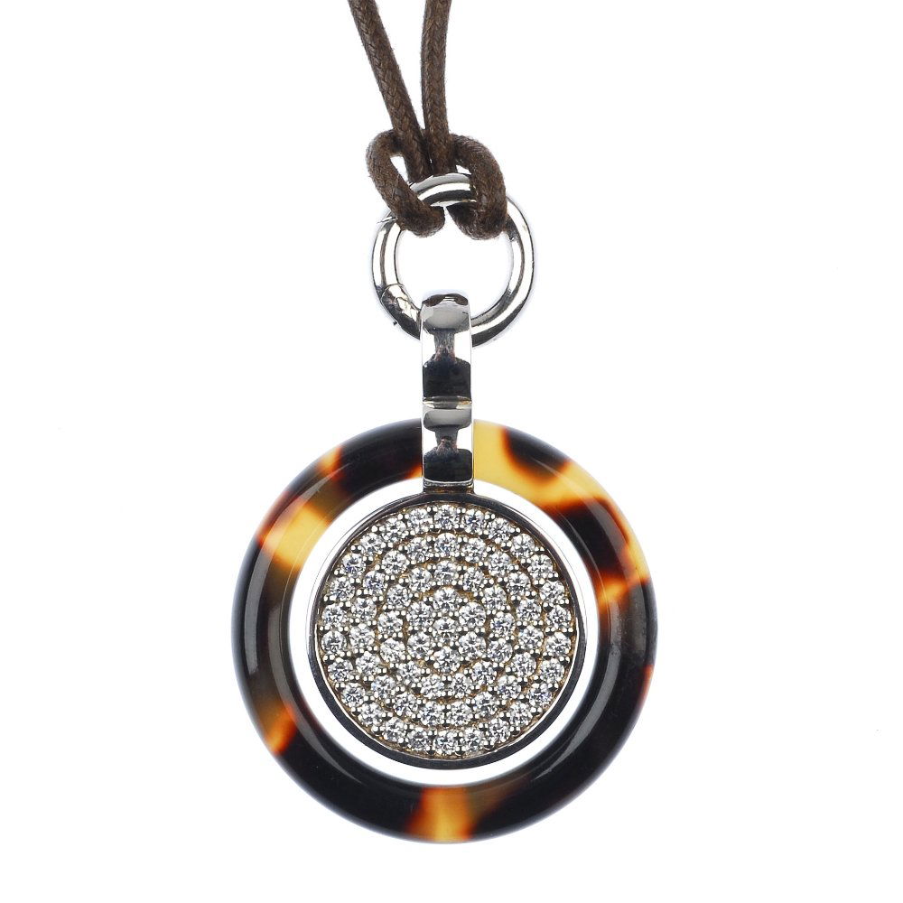 A selection of two bracelets, a ring and a pendant: * A selection of two bracelets, a ring and a pendant. To include a DKNY elongated curb-link bracelet, with white enamel heart accent, a DKNY belcher-link bracelet, with suspended charms, a DKNY textur