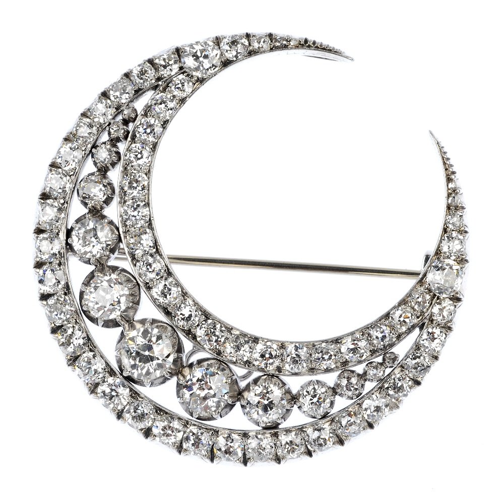 An early 20th century diamond crescent brooch.