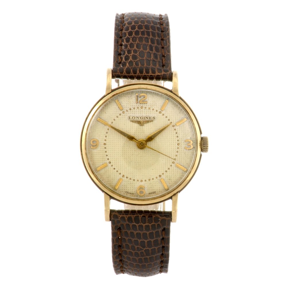 A 9ct gold manual wind gentleman's Longines wrist w: LONGINES - a 9ct gold manual wind gentleman's wrist watch, the cream textured dial with hourly applied gilt batons, quarterly applied Arabic numerals, inner minute track, round case hallmarked London