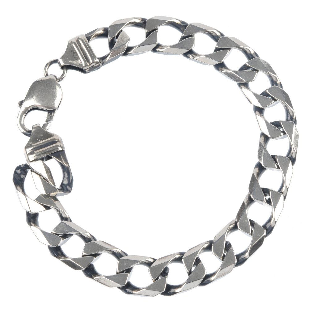 Two bracelets and a pair of ear studs.: * Two bracelets and a pair of ear studs. To include two curb-link bracelets and a pair of cubic zirconia ear studs. One AF. Lengths 20 to 19cms. Weight 86.7gms.